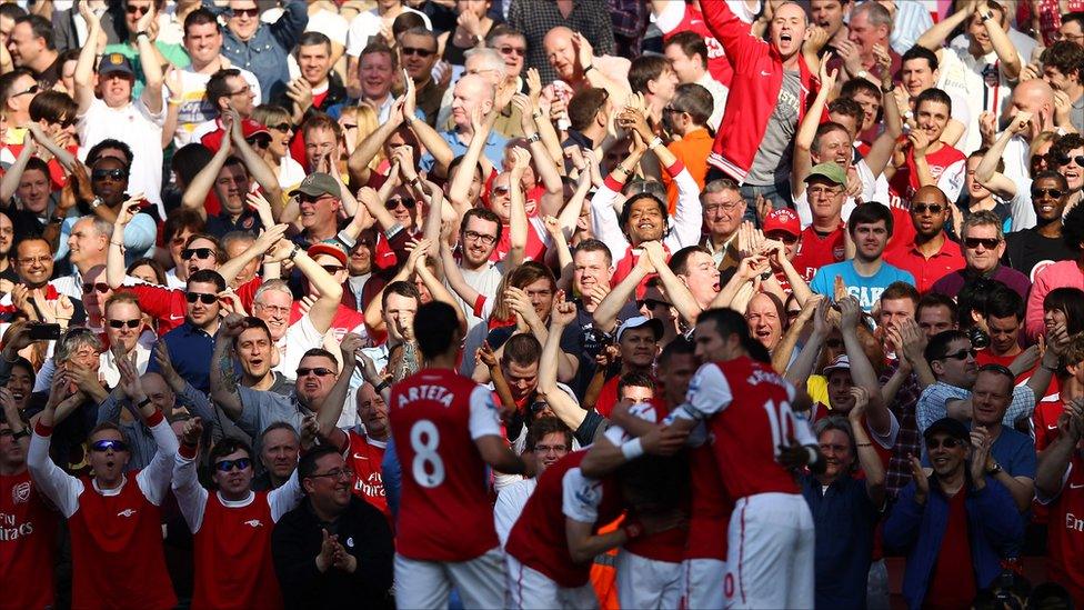 Arsenal players celebrate their goal