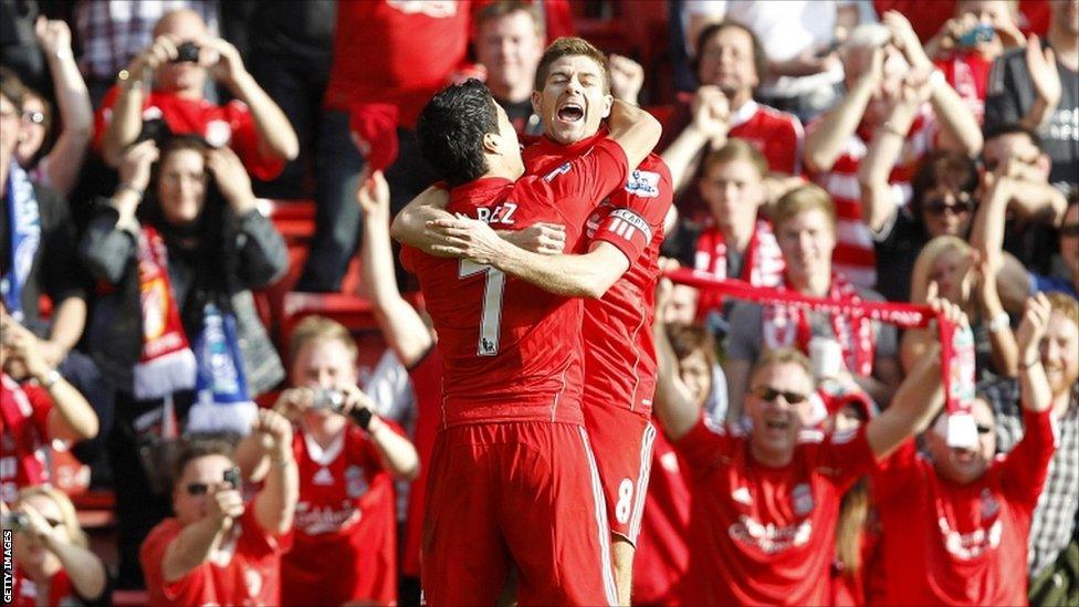 Liverpool's Luis Suarez (left) celebrates scoring their first goal of the game with team-mate Steven Gerrard