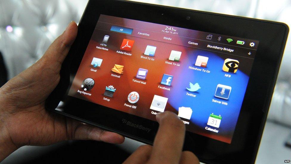 A BlackBerry PlayBook tablet computer showing the home screen.