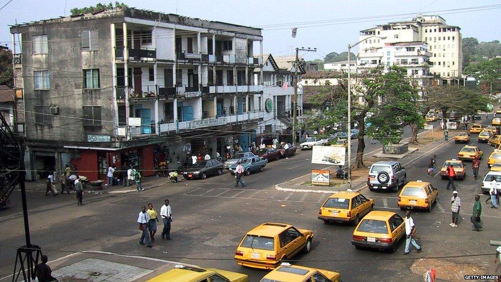 A general view taken 19 February 2002 shows a main avenue of the Liberian capital Monrovia, where traffic and daily life appears normal