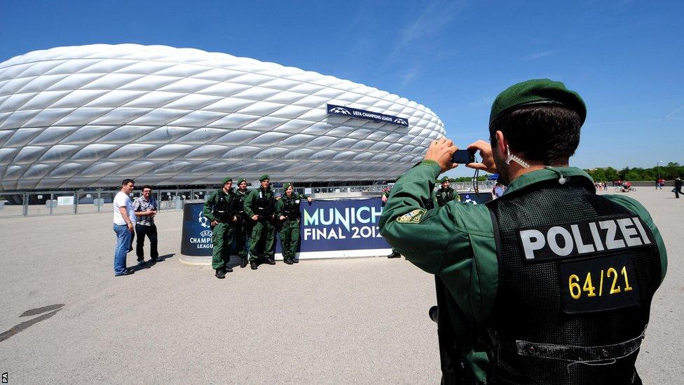 Policeman takes a photograph