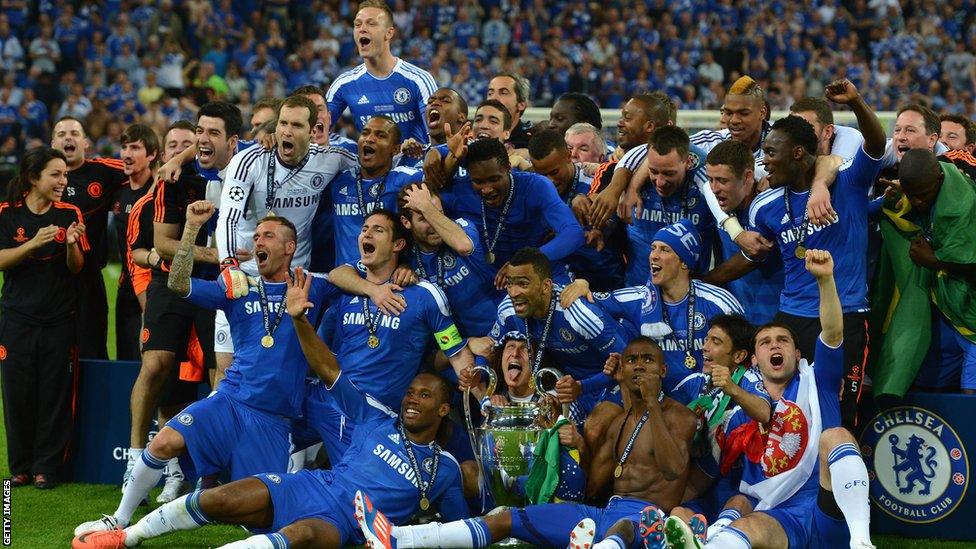 Chelsea players celebrate with trophy