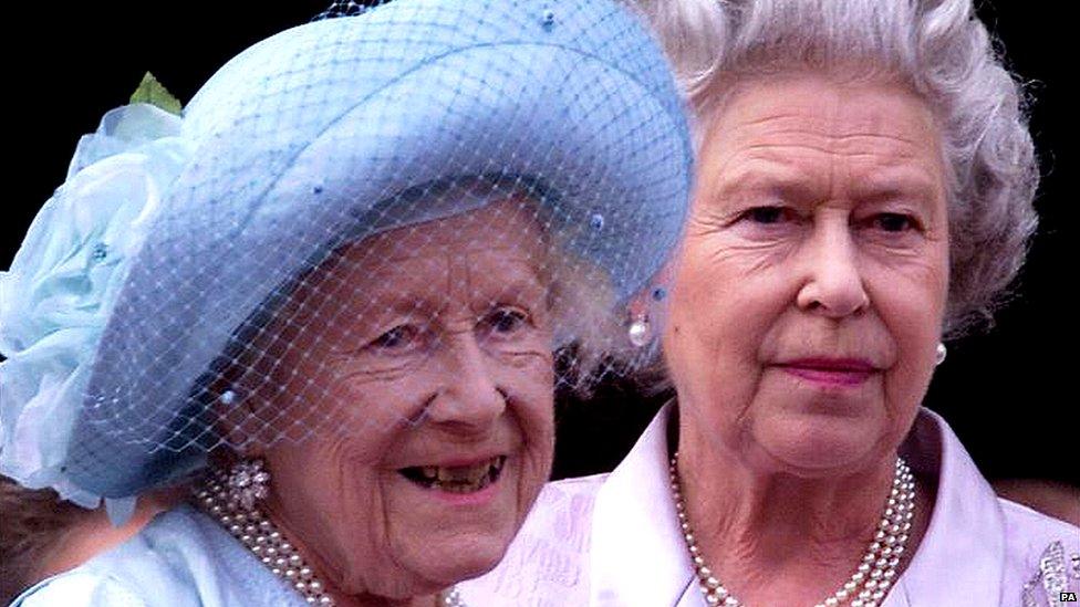 Queen Elizabeth, the Queen Mother celebrates her 100th birthday from the balcony of Buckingham Palace with her daughter the Queen August 4, 2000.