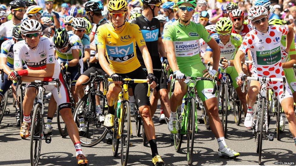 Tejay Van Garderen of the USA and BMC Racing, white jersey winner, Bradley Wiggins of Great Britain and SKY Procycling, yellow jersey winner, Peter Sagan of Slovakia and Liquigas-Cannondale and Thomas Voeckler of France and Team Europcar, polka dot jersey winner pose on the start line ahead of the twentieth and final stage of the 2012 Tour de France, from Rambouillet to the Champs-Elysees on July 22, 2012 in Paris, France.