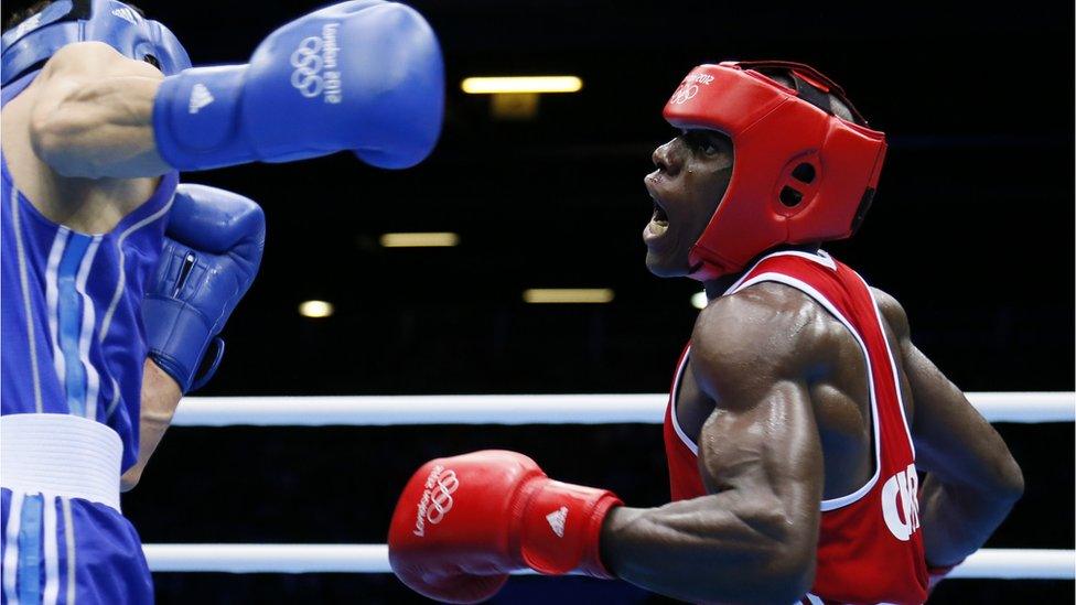 Serge Ambomo boxing against Yakup Sener of Turkey at the London 2012 Olympics