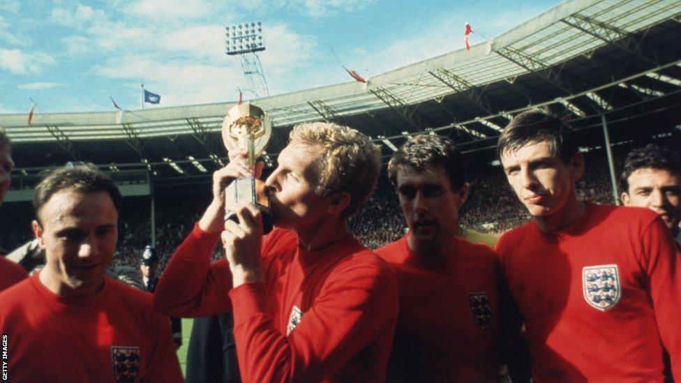 England captain Bobby Moore, whose image and name features heavily at St George's Park, with the World Cup in 1966