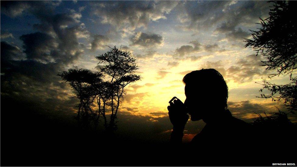 Man drinking coffee in Maasai Mara