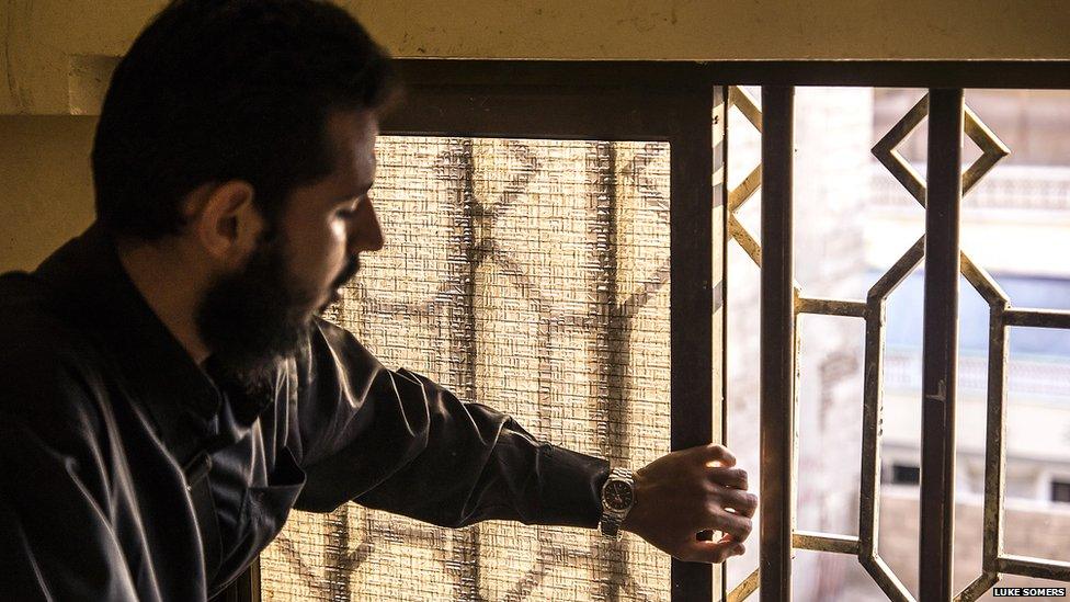 At the movement's headquarters in Aden, a man pauses beside a window through which a fellow "Heraki" was shot dead by military forces in the past year. Photo: Luke Somers