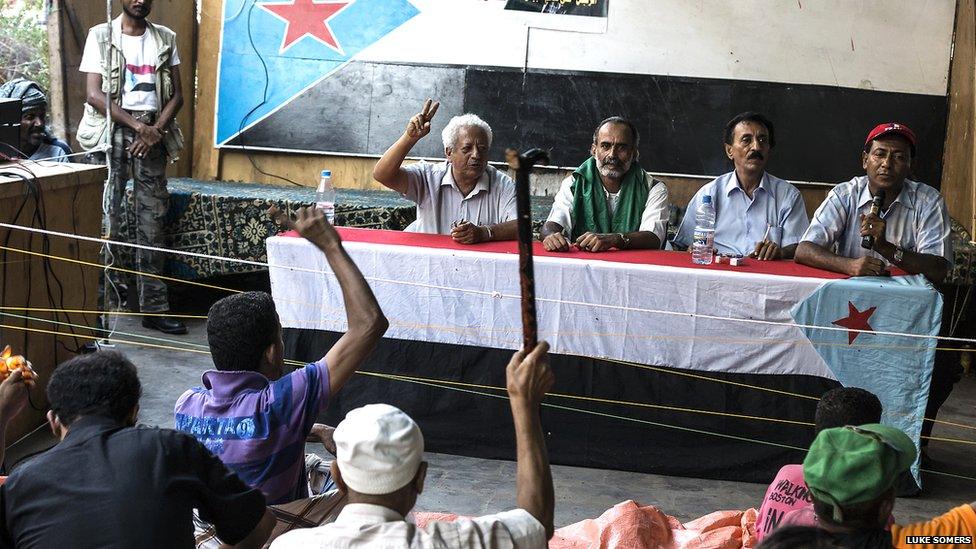 Southern Movement representatives address a crowd of supporters at an open air meeting in Aden’s Crater district. Photo: Luke Somers