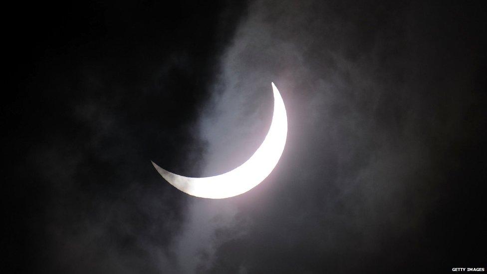 The Moon moving across the Sun