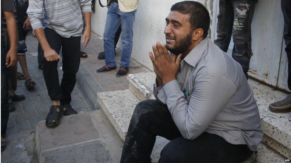 A Palestinian weeps outside the Shifa hospital.