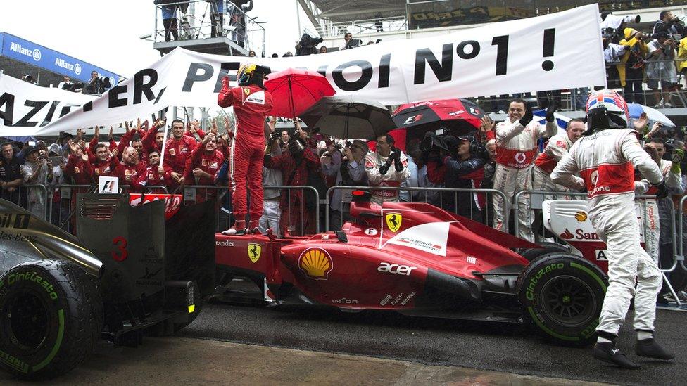 Fernando Alonso (left) and Jenson Button after the Brazilian Grand Prix