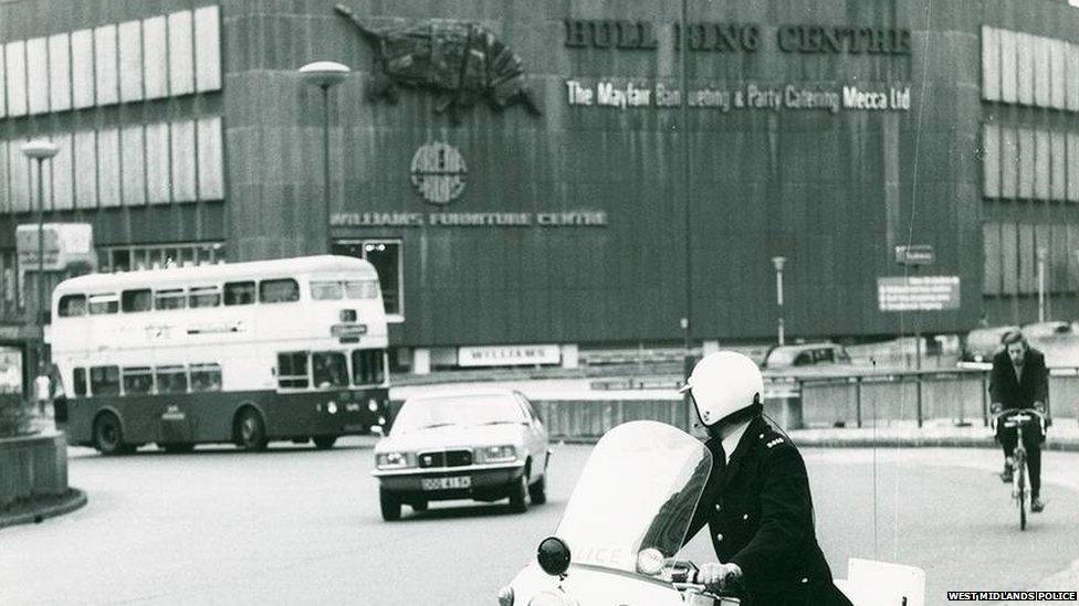 A police officer on a motorcycle outside Birmingham's Bull Ring shopping centre in the early 1970s.