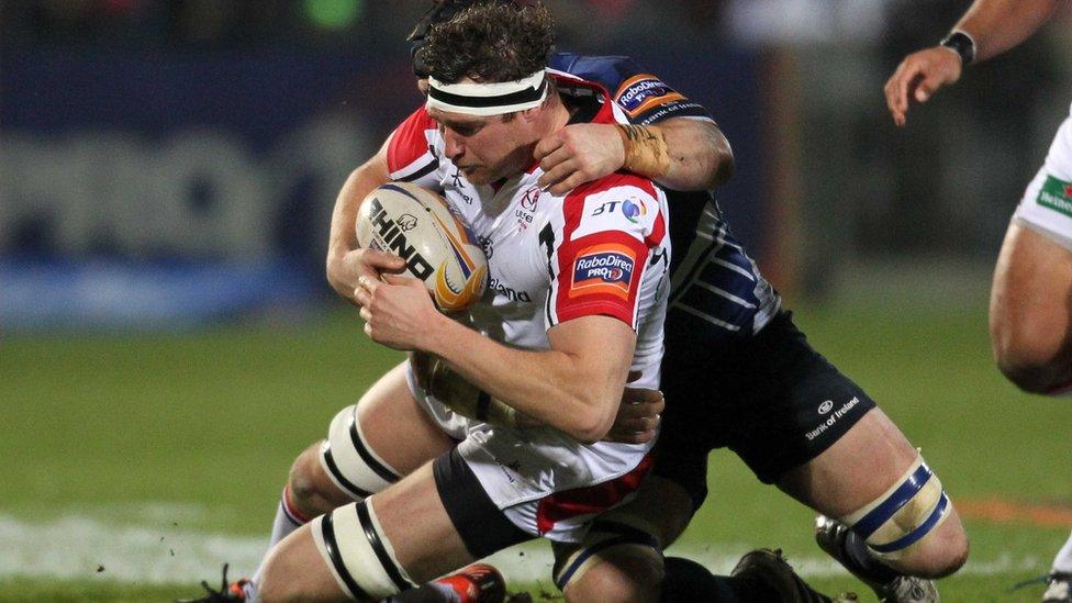 Ulster second row Neil McComb is tackled by Leinster's Sean O'Brien