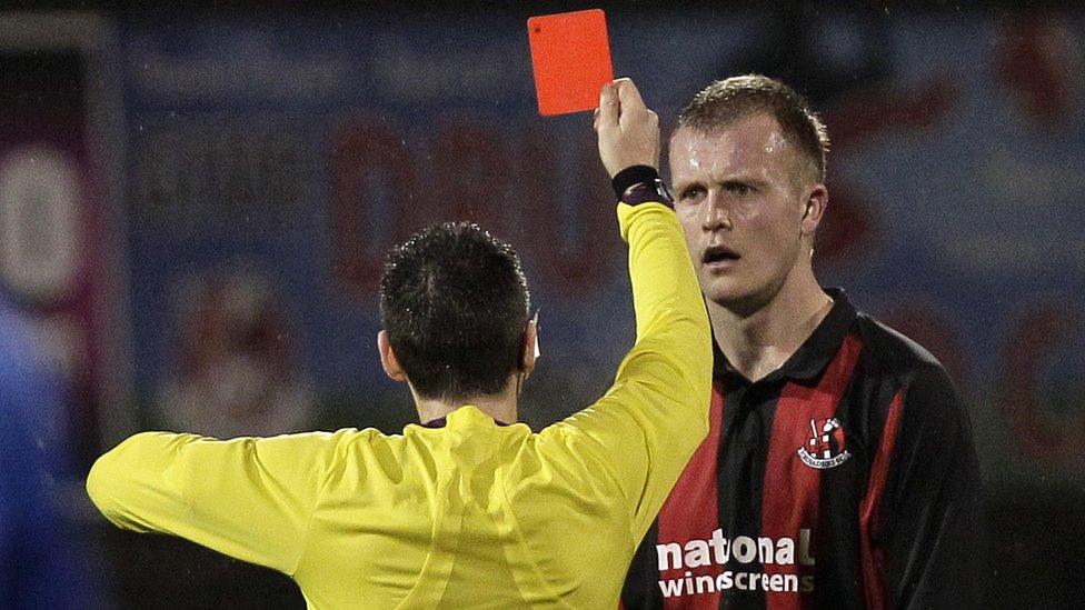 Jordan Owens is sent off by referee Ross Dunlop