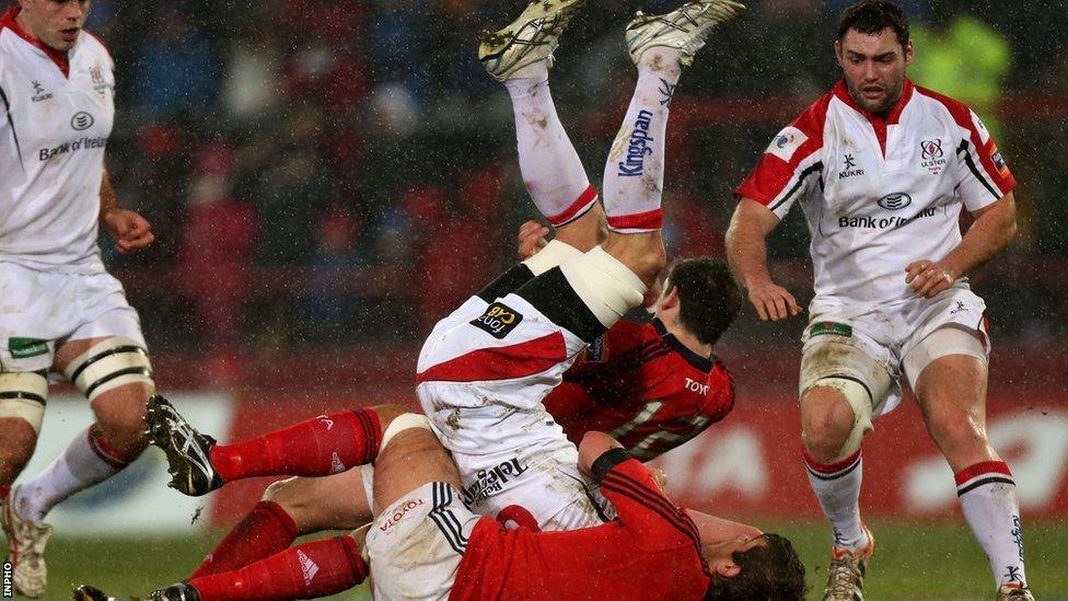 Robbie Diack is tackled by Munster's James Downey