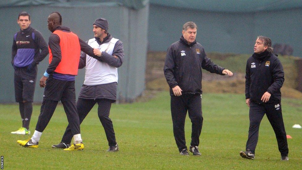 Mario Balotelli (second left) and Roberto Mancini (far right)