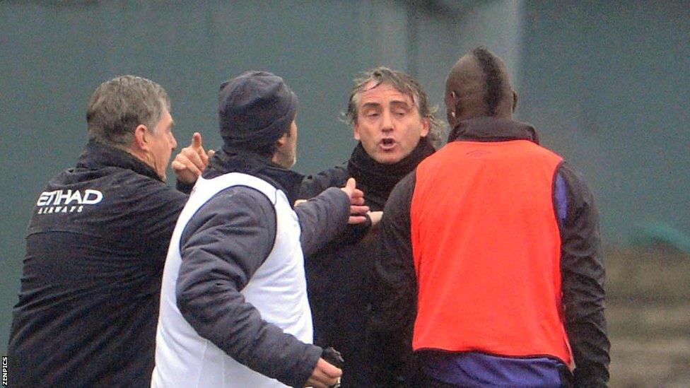 Mario Balotelli (far right) and Roberto Mancini (second right)