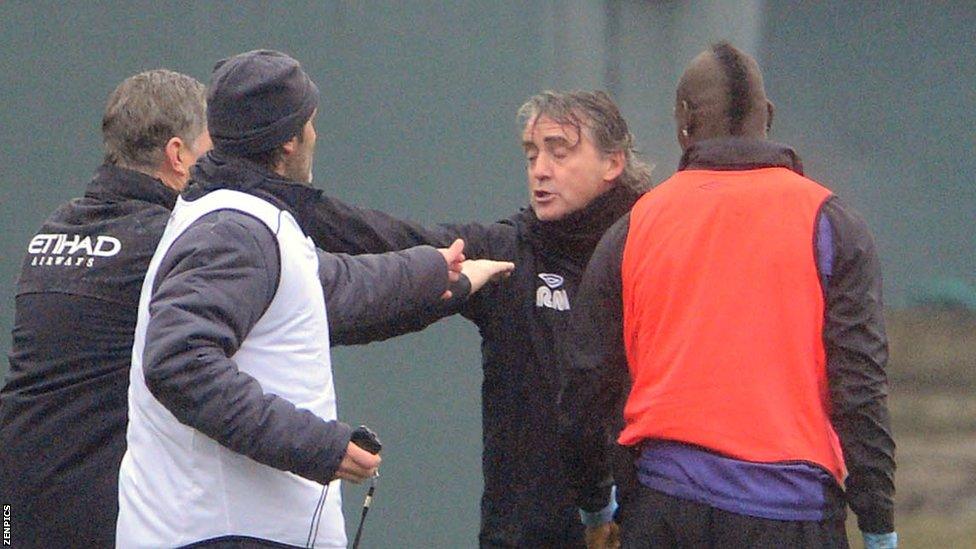 Mario Balotelli (far right) and Roberto Mancini (second right)