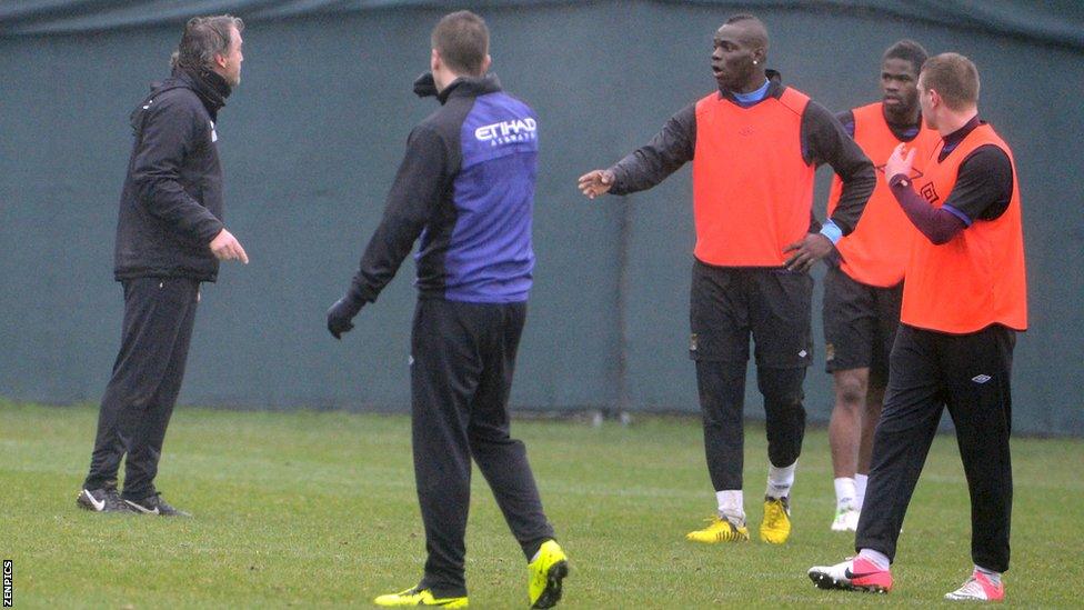 Roberto Mancini (far left) and Mario Balotelli (centre)