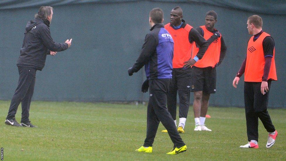 Roberto Mancini (far left) and Mario Balotelli (centre)