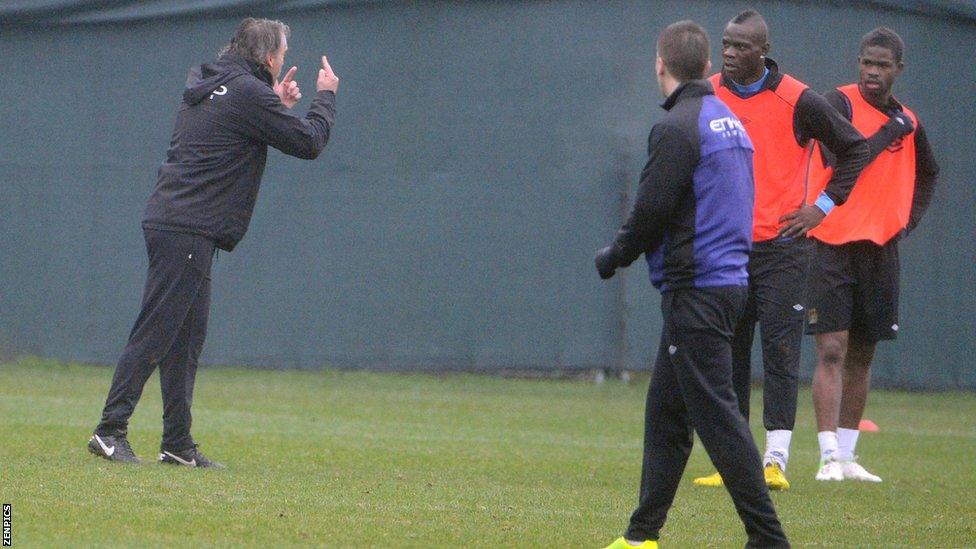 Roberto Mancini (far left) and Mario Balotelli (second from left)