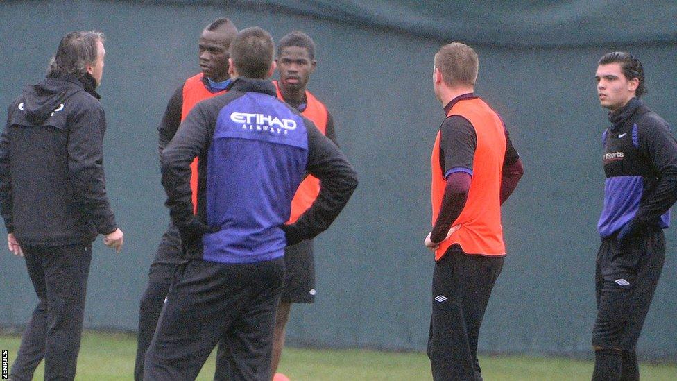 Roberto Mancini (far left) and Mario Balotelli (second from left)