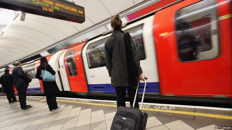 Passenger waits to get on train