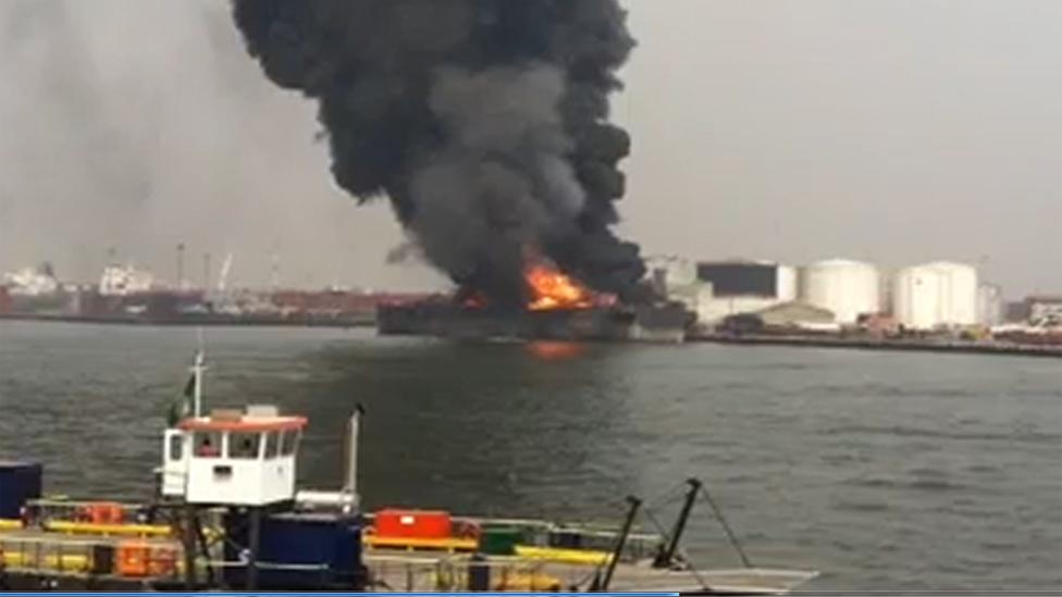 Smoke and flames of the explosion in Lagos port on 9 January 2013