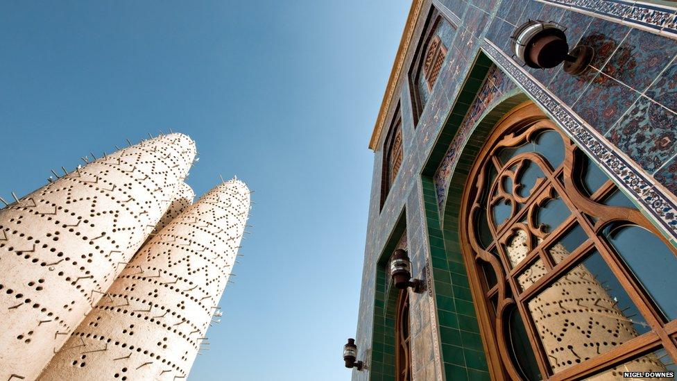 The Katara mosque on the right is part of the Katara cultural village, a centre for literature, music, visual art, conventions and exhibitions. The unusual looking building on the left is a traditional dove cot.