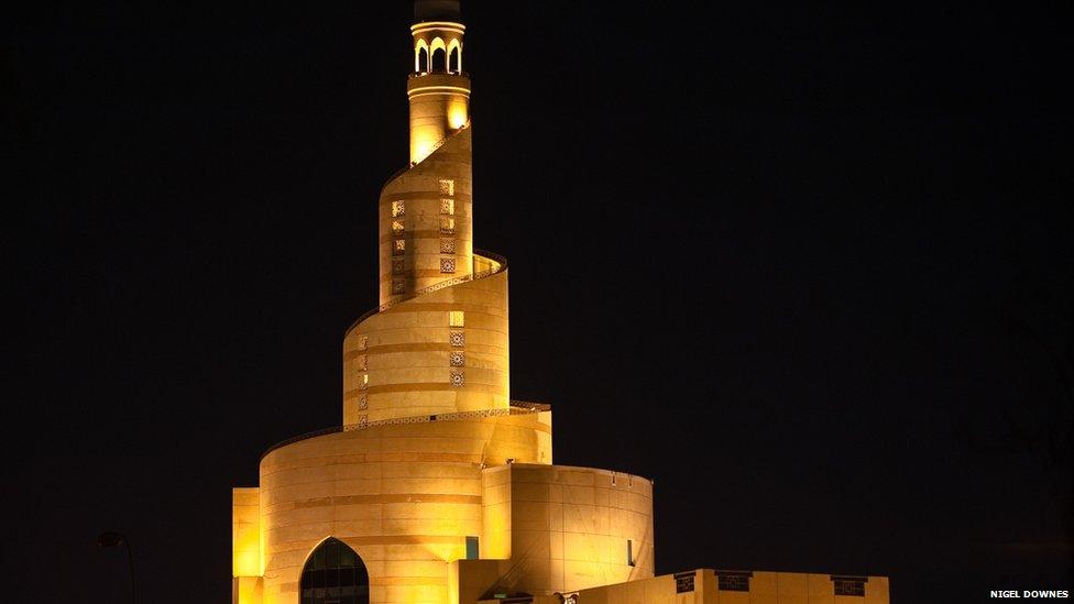 The Qatar Islamic Cultural Center, a prominent landmark visible from far out at sea. The lighthouse motif is a nod to Qatar's rich seafaring heritage.