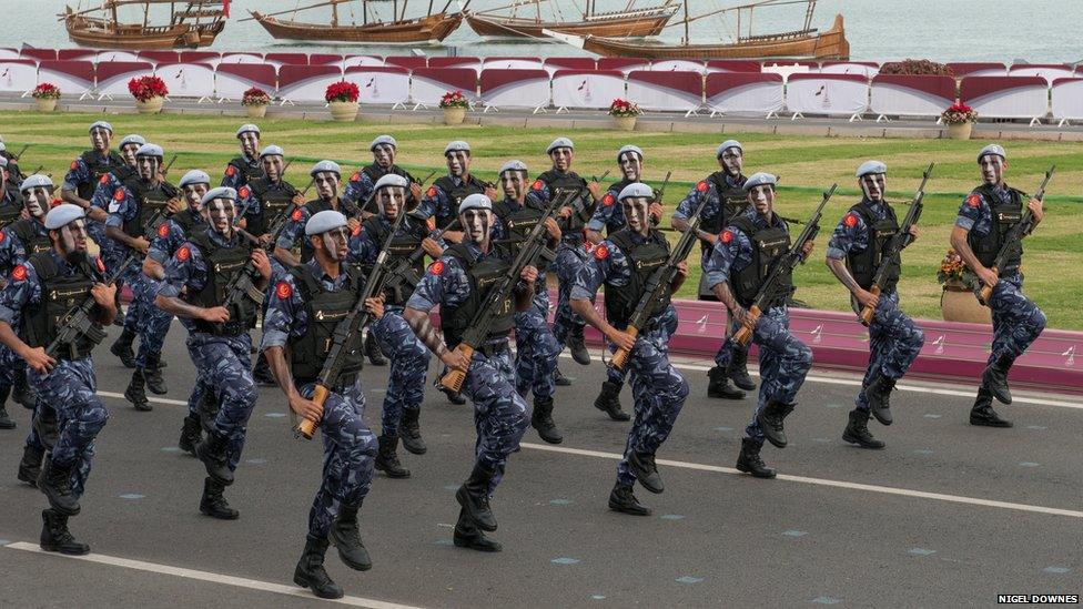 Members of the armed forces parade for National Day Parade in Doha. The country has a small armed force but has actively supported revolutions in Syria and Libya with money, diplomatic action and even weapons.