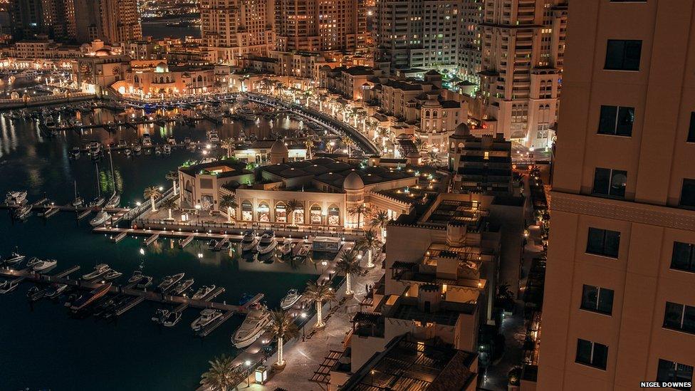 Porto Arabia, part of a huge construction project, is a man-made island off the coast of Qatar. Its waterfront cafes and restaurants are fast becoming a place where the local and expat communities meet, says Nigel Downes.