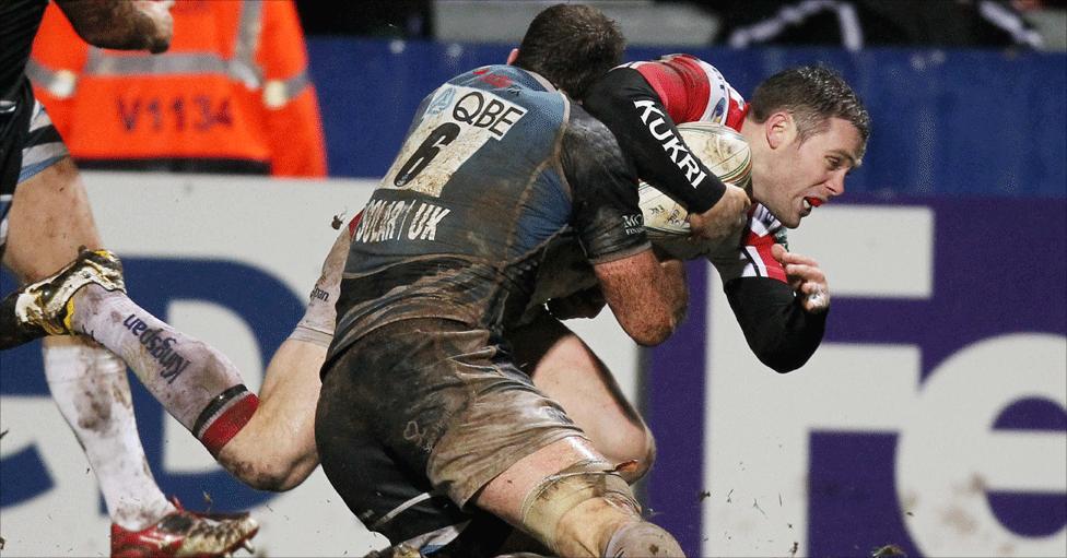 James Eddie fails to stop Darren Cave scoring Ulster's late third try of the game at Ravenhill