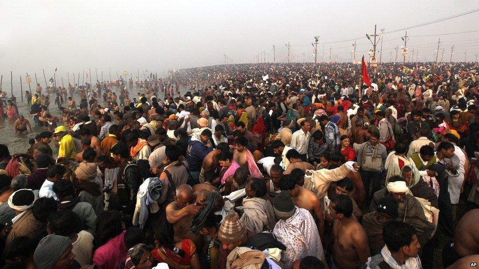 Millions of Hindu devotees gather early in the morning at Sangam, the confluence of the Rivers Ganges, Yamuna and mythical Saraswati, on the first day of the Kumbh Mela.