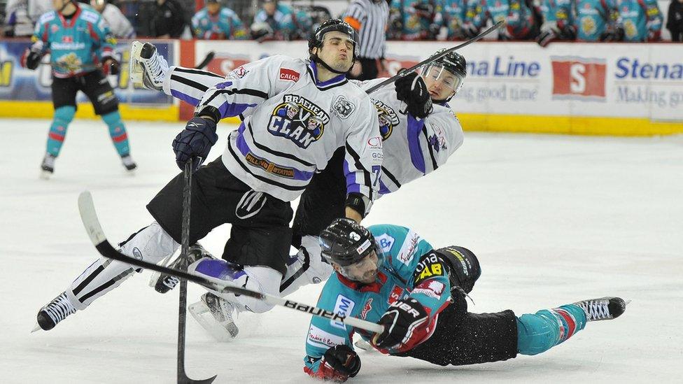 Jeff Mason of the Belfast Giants in action against Davide Nicoletti (left) and Steve Birnstill of the Braehead Clan