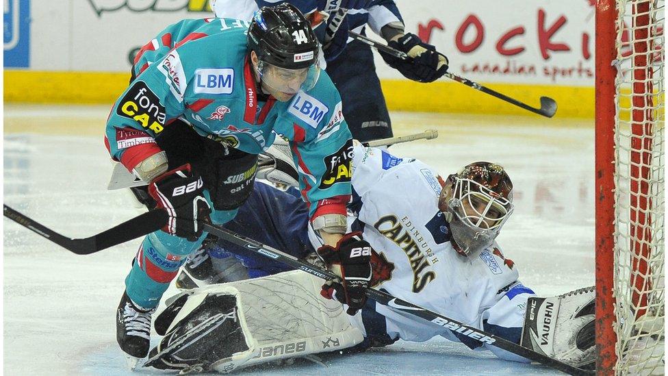 Daymen Rycroft of the Belfast Giants in action against Tomas Hiadlousky of the Edinburgh Capitals