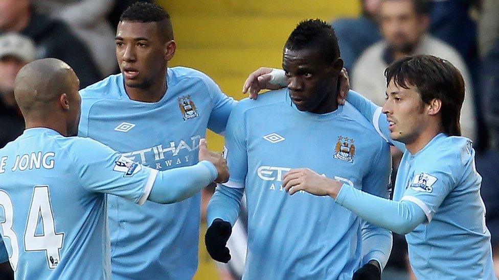 Mario Balotelli with Manchester City team mates, Nigel De Jong, Jerome Boatang, and David Silva.