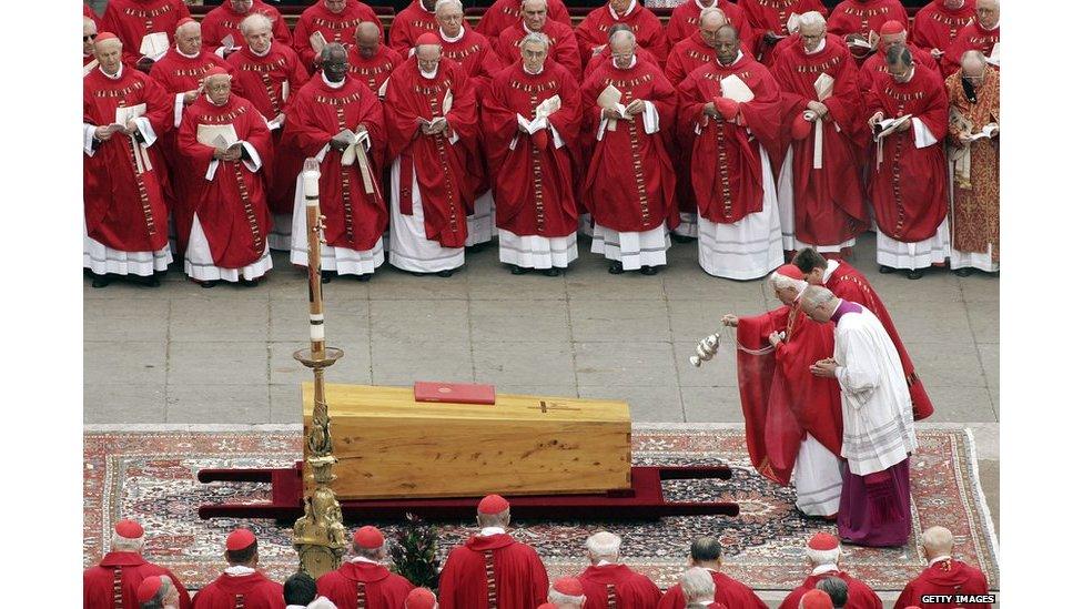 Incense is cast over the coffin of Pope John Paul II by German Cardinal Joseph Ratzinger