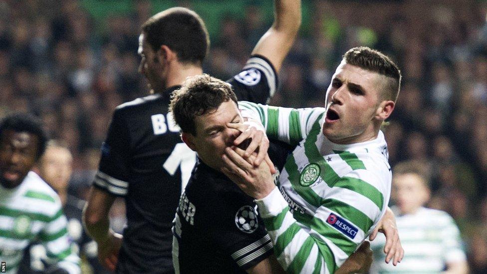 Celtic striker Gary Hooper (right) tussles with Stephan Lichsteiner