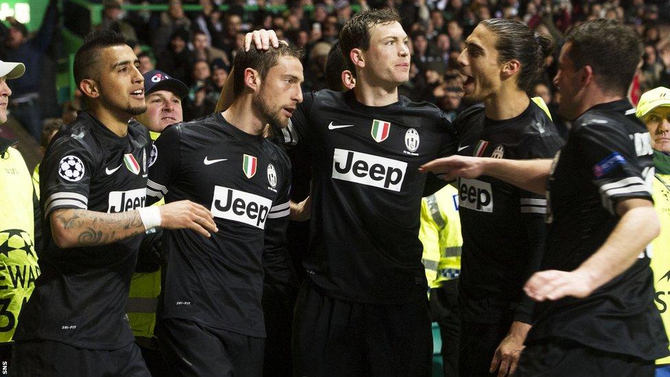 Juventus celebrate one of their three goals in the victory at Celtic Park