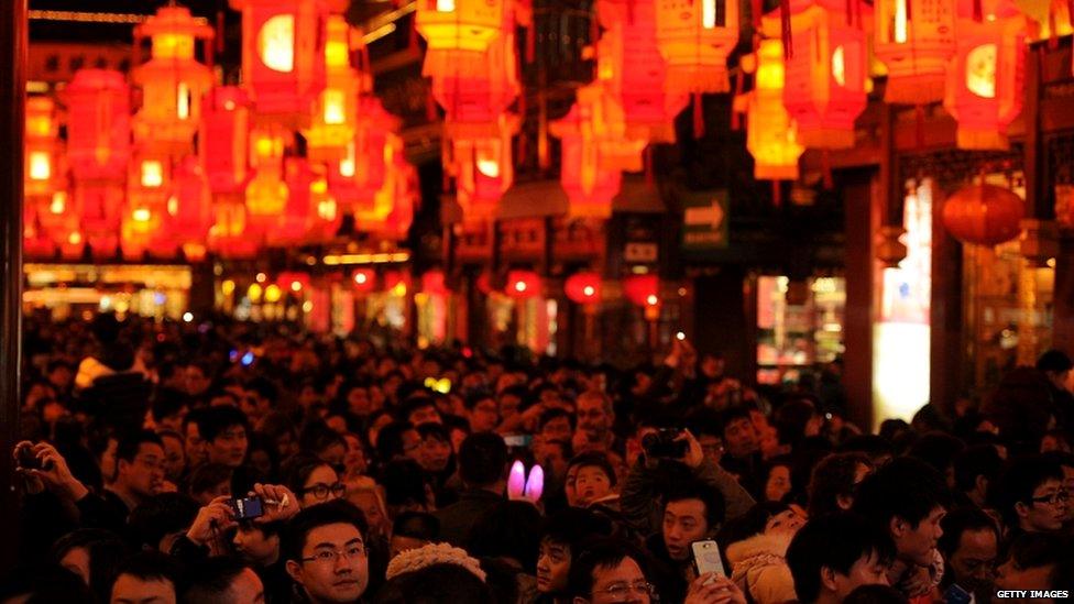 Crowds admire a lantern display in the Yuyuan Gardens in Shanghai