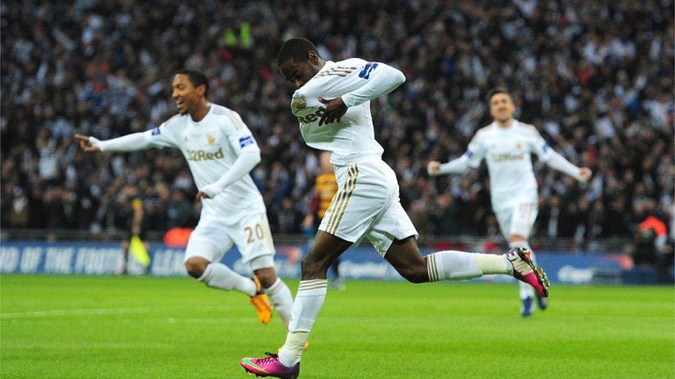 Swansea City"s Nathan Dyer (centre) celebrates scoring their first goal of the game during the Capital One Cup Final match at Wembley