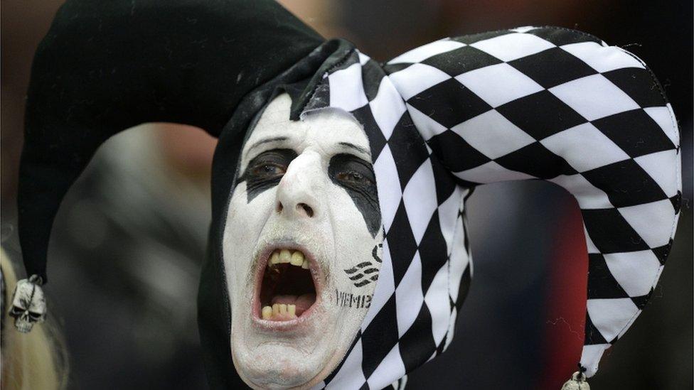 A Swansea fan in full voice for the match against Bradford City at Wembley