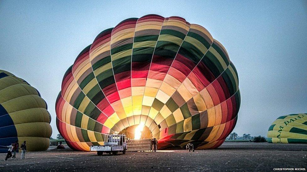 A balloon inflates at the launch area before the morning flight on 26 February 2013