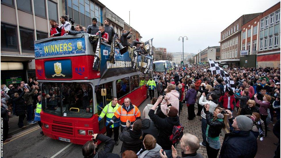 The Swansea cortege moves on through the throng