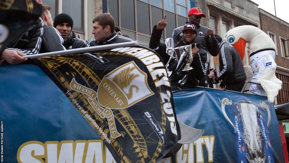 The Swansea players look cold, but are warmed by the fans' response