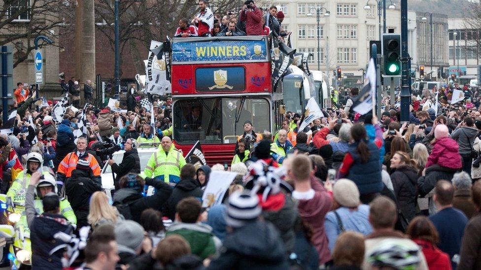 The celebration parade begins as Swansea fans gather to see their Capital One Cup heroes travel through the city on their victory parade