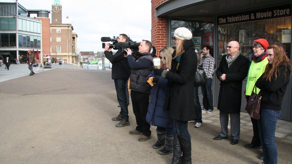 Cameramen and people gathered outside The Forum, Norwich