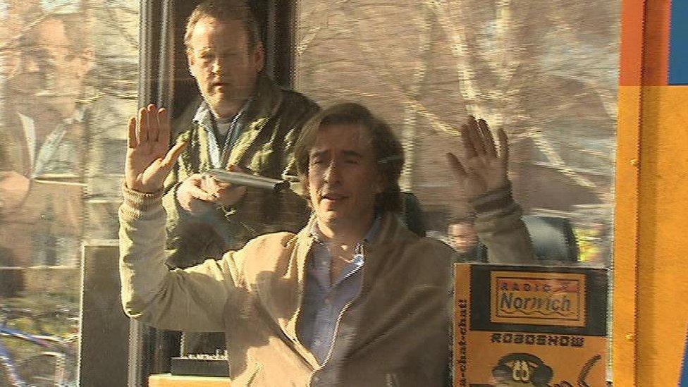 Actor Colm Meaney holds a gun to Steve Coogan's head